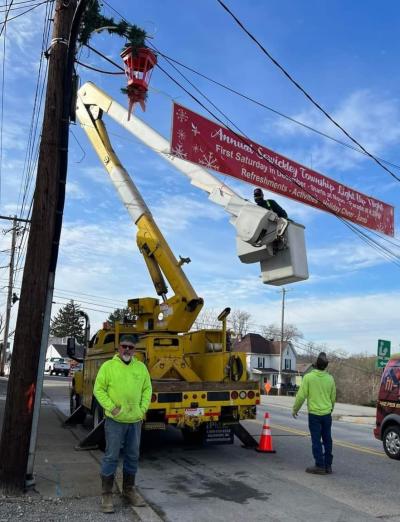 Road Crew Hanging Light Up Night Banner Sewickley Avenue